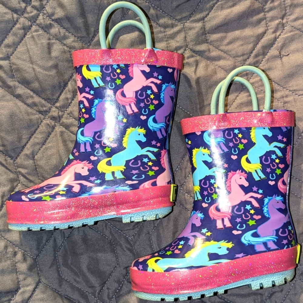 Little girls size 5/6 rain boot, pink and purple with unicorns. Like new.